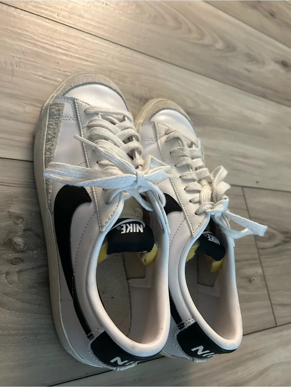Nike White and Black Low-Top Sneakers with Yellow Tongue Accent